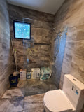 walk-in shower with chrome fittings