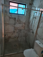 Wall to wall semi-frame shower screen with chrome aluminium frame