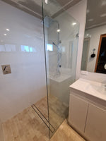walk-in shower screen with chrome brackets